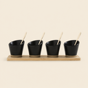 SET X 4 COPETINEROS DE PORCELANA NEGRA BASE BAMBOO Y CUCHARAS DORADAS 30X8 CM